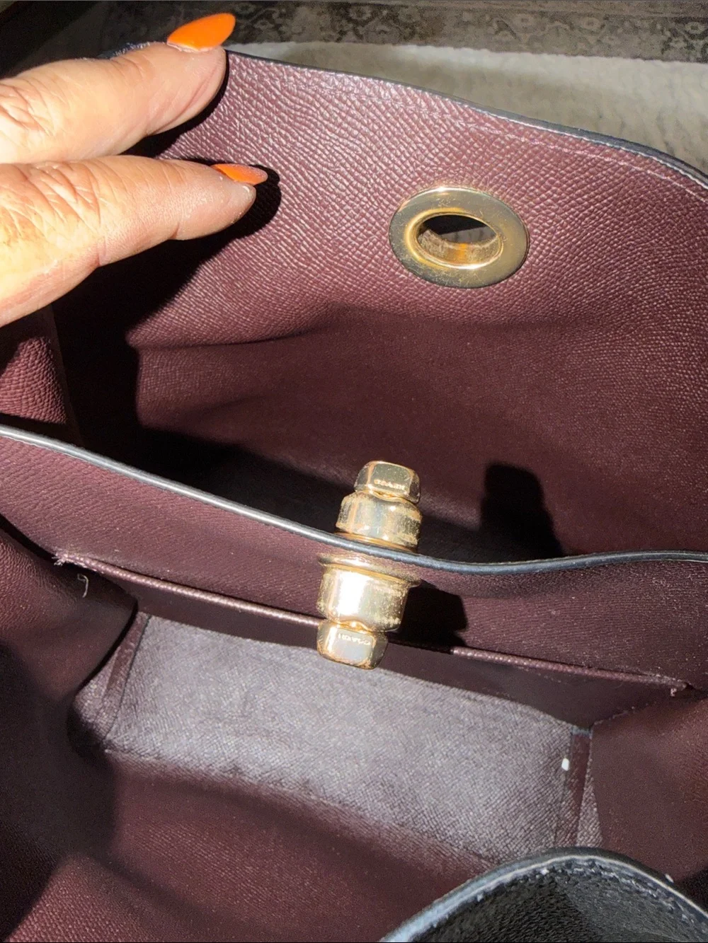 Coach bucket bag, likely the Charlie or Town model